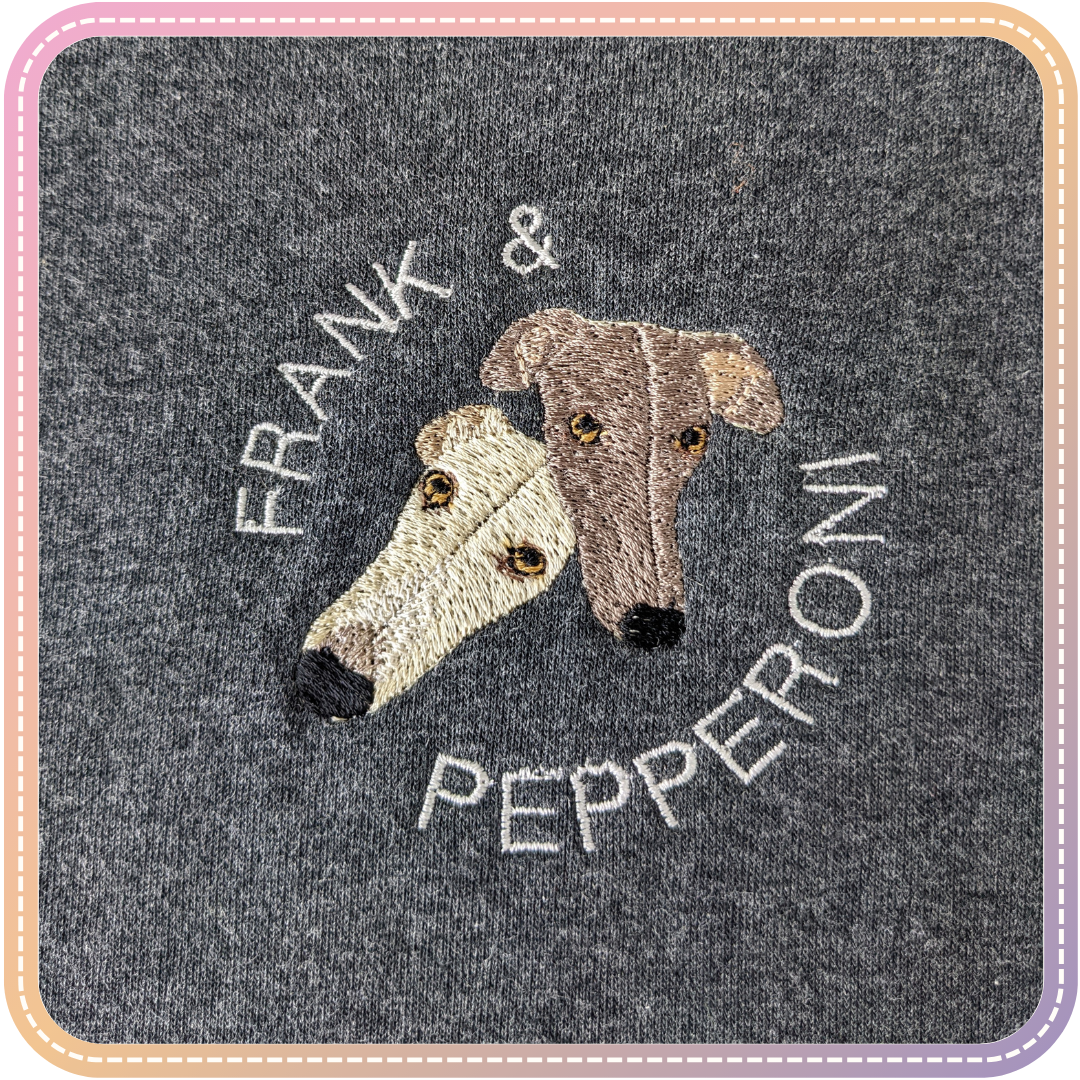 close up of greyhounds embroidered on a grey hoodie