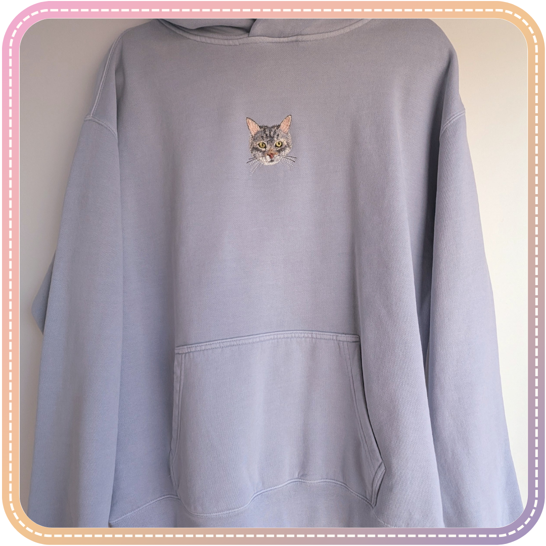blue hoodie with tabby cat embroidery