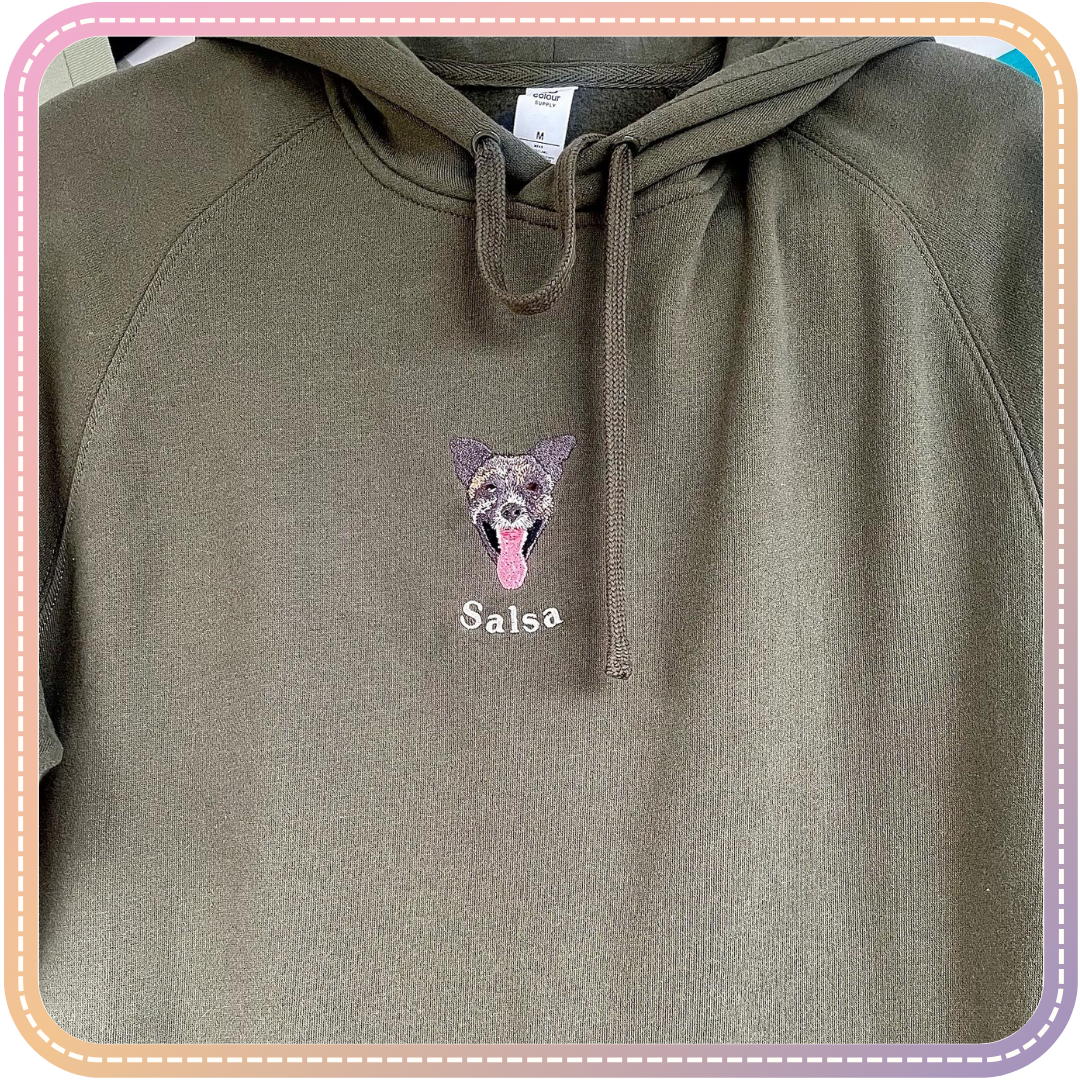 close up of green hoodie with embroidery of a dog called Salsa