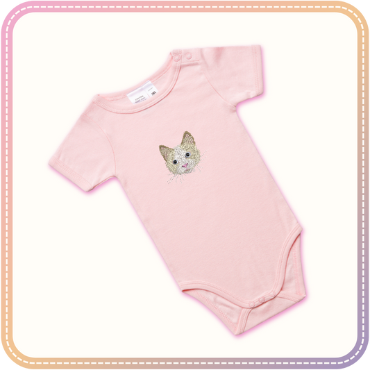 mockup of a pink baby onesie with a cat embroidered in the centre