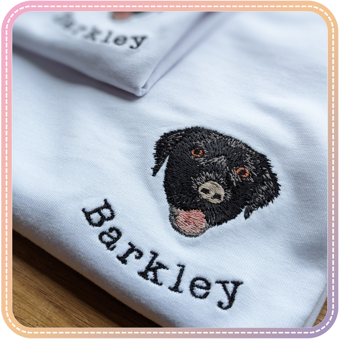 close up of an embroidered tshirt of a black labrador called Barkley