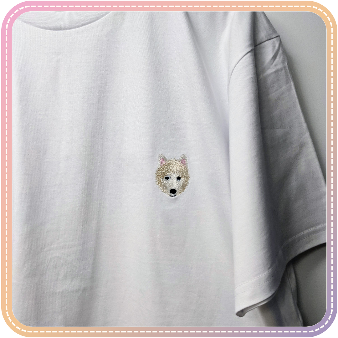 image of a white Shibu embroidered on a white tshirt