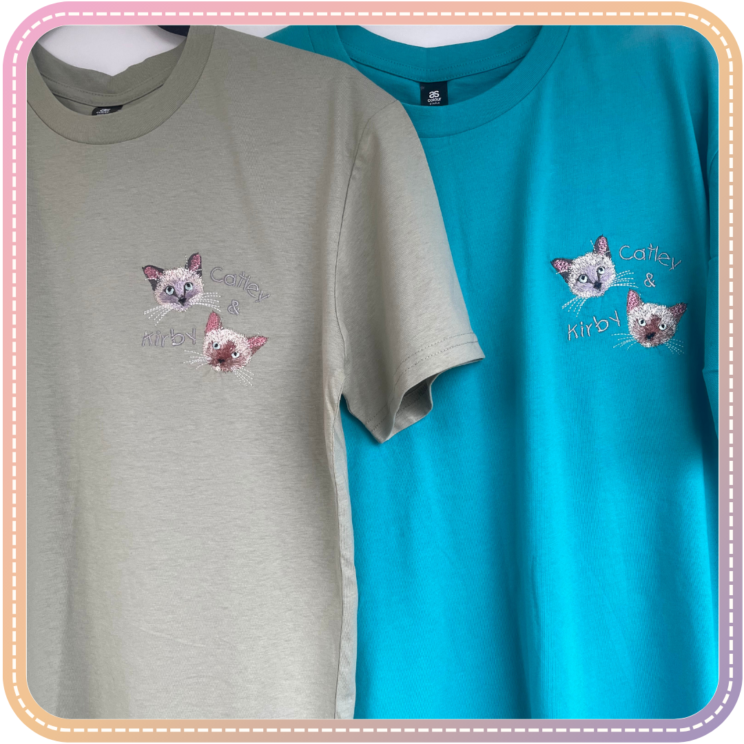 two matching embroidered tshirts each with 2 cats called Kirby and Catley